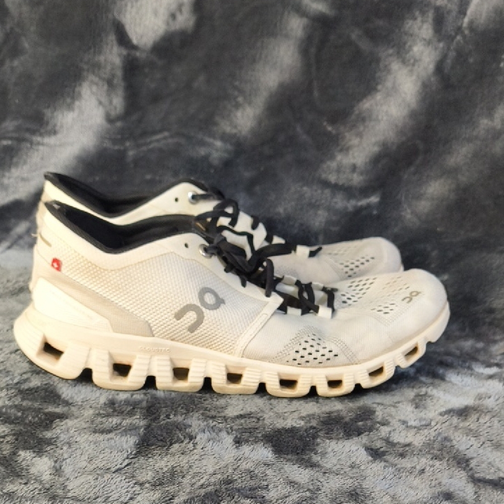 On Running White and Black Athletic Shoes